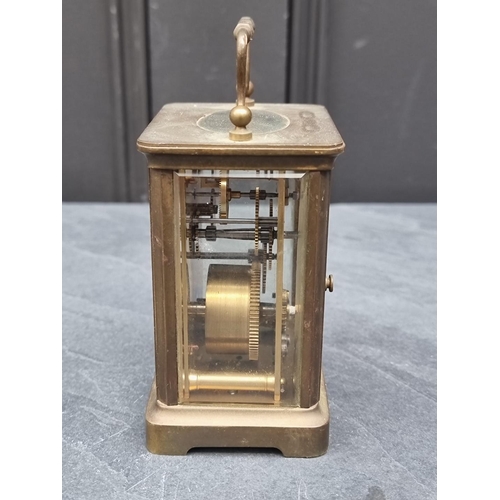 1345 - An old brass carriage timepiece, height including handle 13.5cm.