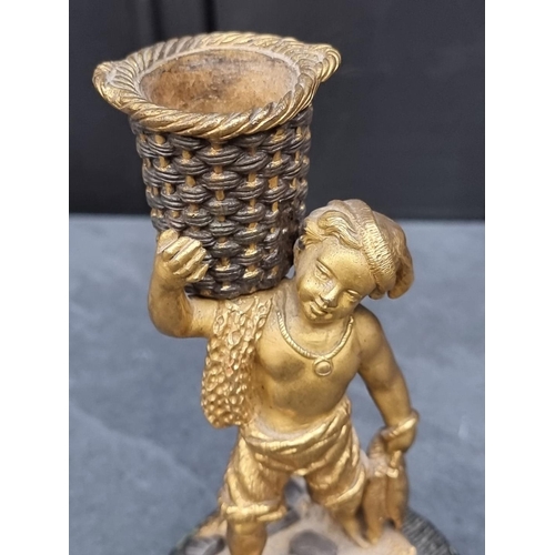 1353 - A gilt bronze fisherboy, on green marble base, 15cm high.