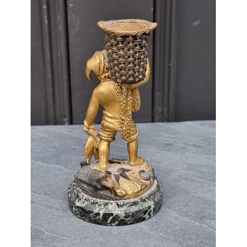 1353 - A gilt bronze fisherboy, on green marble base, 15cm high.