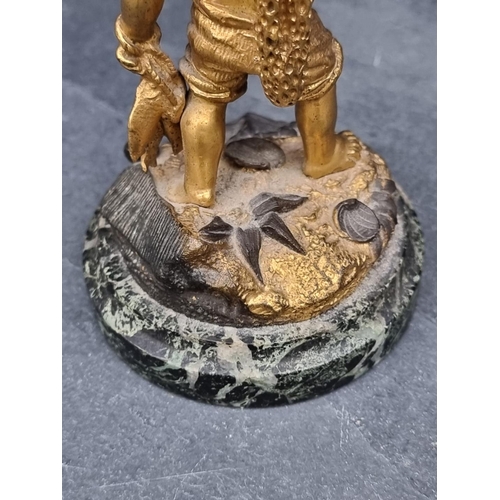 1353 - A gilt bronze fisherboy, on green marble base, 15cm high.