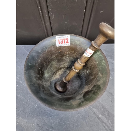 1372 - A large 17th century bronze mortar, 13.5cm high x 15.4cm diameter; with 19.7cm bronze pestle. (2)... 