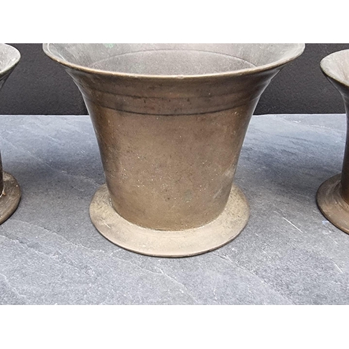 1394 - Three 18th century brass mortars, largest 9.8cm high. (3)