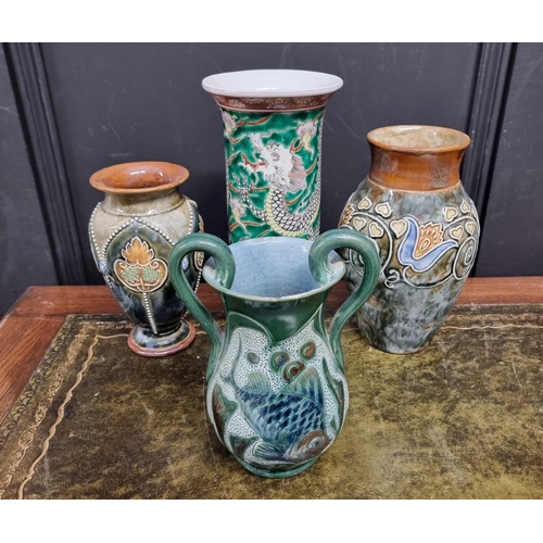 1402 - Four various vases, to include a Brannam twin handled example, 18cm high; and a famille verte s... 