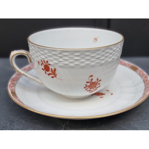 1414 - A large pair of Herend cups and saucers, the saucers 21.5cm diameter. 