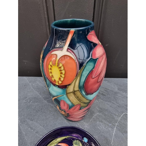 1419 - A Moorcroft vase, tube lined with a dragonfly and flowers, 21cm high; together with a similar 'Celti... 