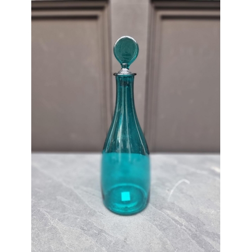 1432 - A Georgian green glass decanter and stopper, 30cm high.