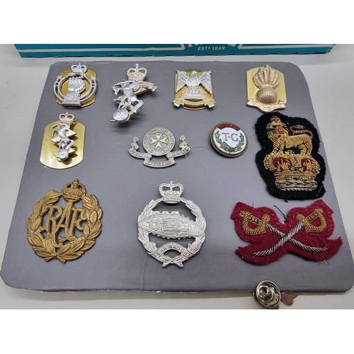 1453 - A collection of badges and coins, to include military examples.