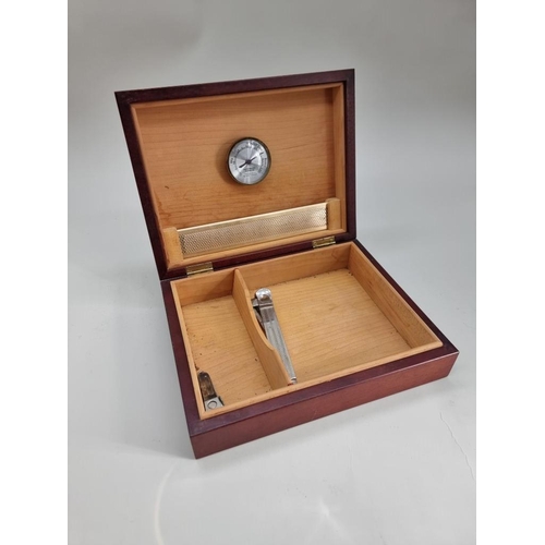 155 - A mahogany humidor, with presentation plaque to hinged top, 25.5cm wide; together with two cigar cut... 