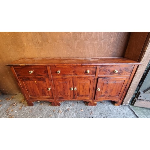 1125 - A solid yew dresser base, by Stephen Clear, 182cm wide.