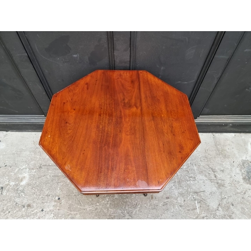 1126 - A Victorian walnut octagonal centre table, 74cm wide.