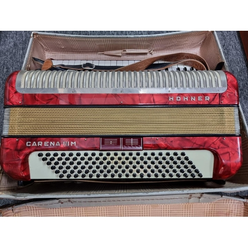 1334 - A Hohner 'Carena IIM' piano accordion, in case.