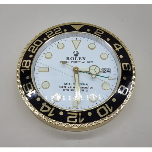 1522 - A Rolex style wall clock, with battery movement, 34cm diameter, (crack to glass).