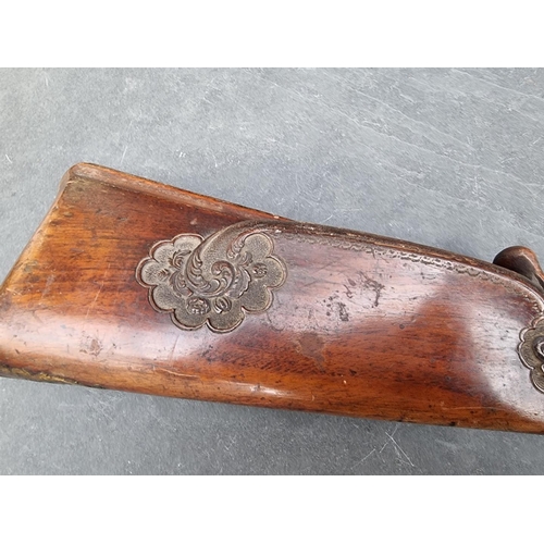 1539 - A circa 1800 muzzle loading double barrel flintlock shotgun, having carved walnut stock and 60cm bar... 