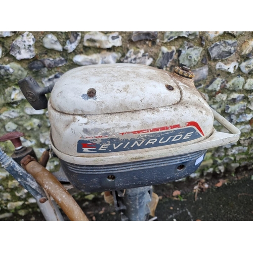 1558 - An Evinrude 'Yacht Twin' outboard motor, on galvanized stand.  