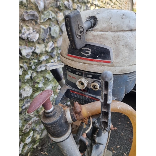 1558 - An Evinrude 'Yacht Twin' outboard motor, on galvanized stand.  