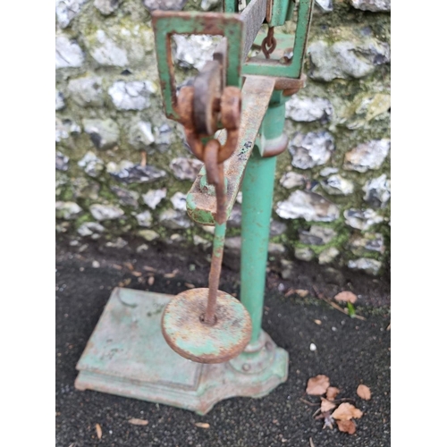 1569 - A set of vintage green painted weighing scales. 