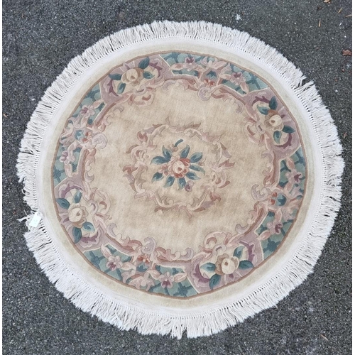 1580 - A Chinese floral circular rug, 147cm.