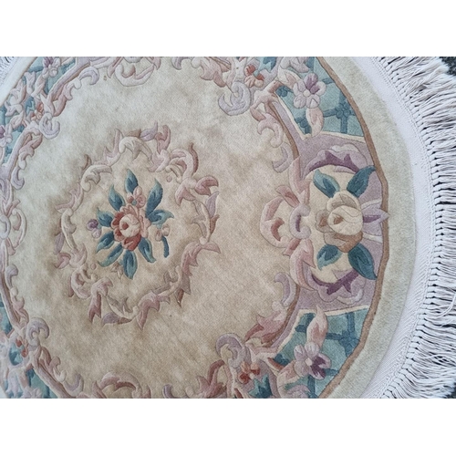 1580 - A Chinese floral circular rug, 147cm.