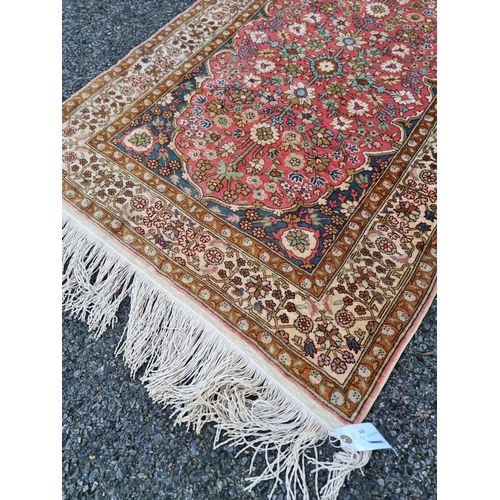 1581 - A small Persian silk rug, having allover floral decoration, 126 x 74cm.