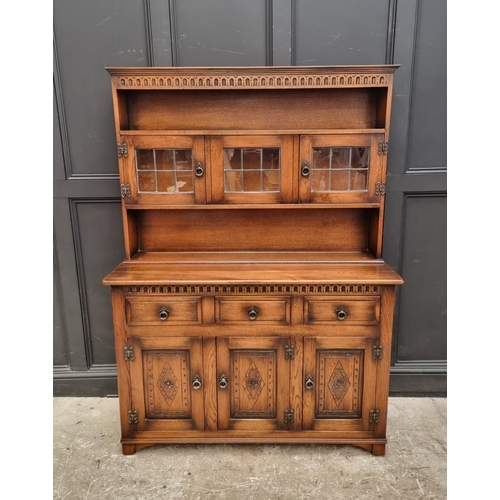 1003 - A 'Mellowcraft' oak dresser and rack, 131cm wide.