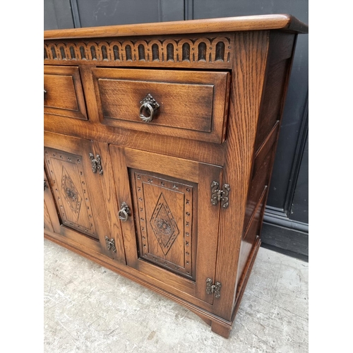 1003 - A 'Mellowcraft' oak dresser and rack, 131cm wide.