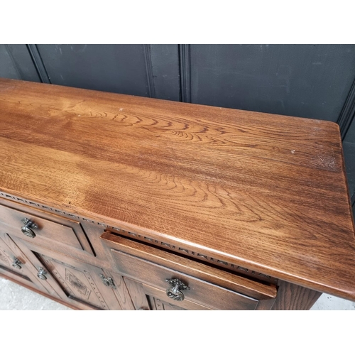 1003 - A 'Mellowcraft' oak dresser and rack, 131cm wide.