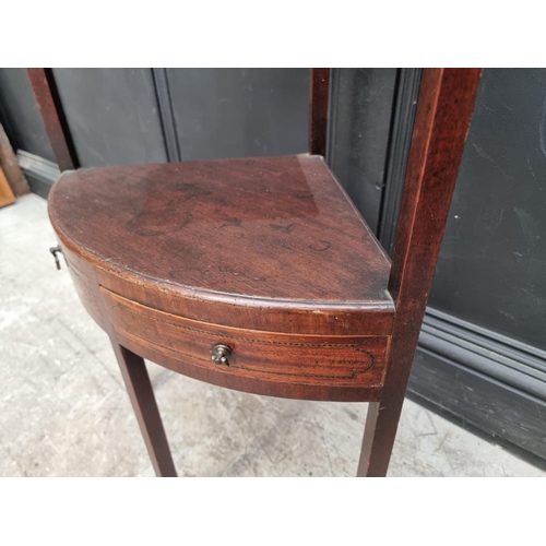 1005 - A George III mahogany corner washstand, 101cm high.