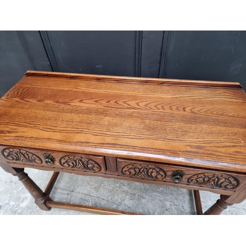 1006 - An 'Old Charm' oak two drawer side table, 106.5cm wide.