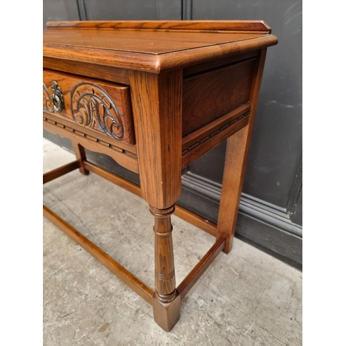 1006 - An 'Old Charm' oak two drawer side table, 106.5cm wide.