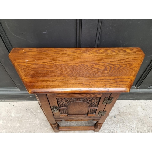 1008 - An 'Old Charm' oak credance cupboard, 81cm wide.