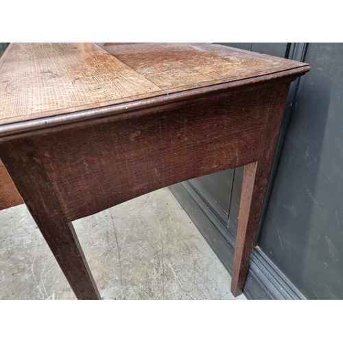 1010 - WITHDRAWN An unusual early 19th century oak and mahogany single drawer side table, 77.5cm wide.... 