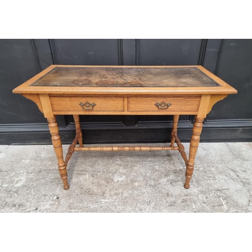 1019 - An Edwardian oak desk, 106.5cm wide.