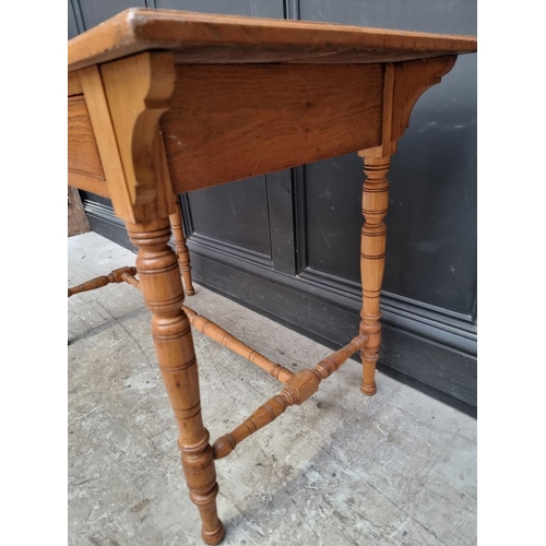 1019 - An Edwardian oak desk, 106.5cm wide.