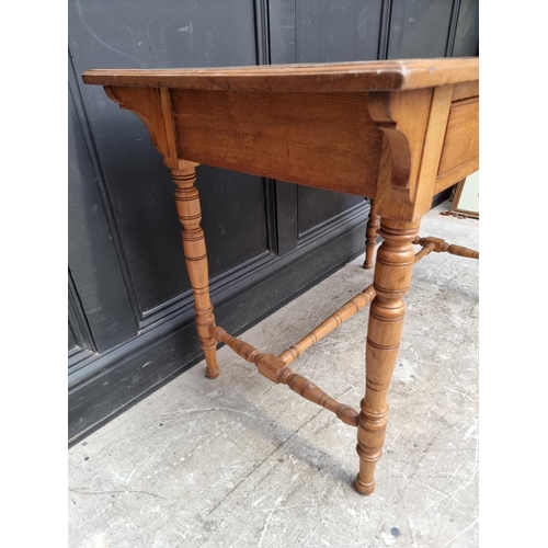 1019 - An Edwardian oak desk, 106.5cm wide.