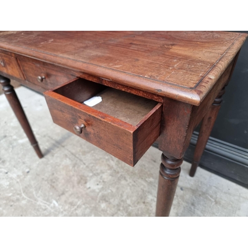 1021 - A Victorian mahogany side table, with a pair of frieze drawers flanking a dummy drawer, 90.5cm ... 