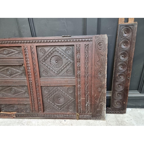 1027 - A carved oak panel, 17th century and later, 186.5 x 85cm, (made up).