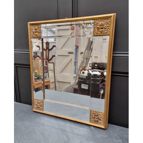 1031 - A gilt gesso framed wall mirror, 73.5 x 63.5cm.