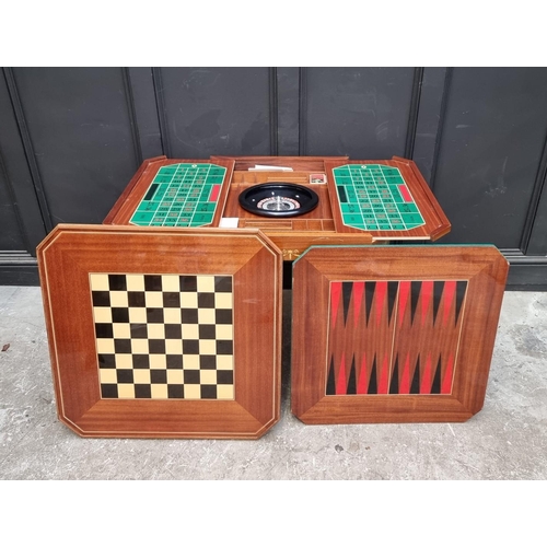 1038 - An Italian marquetry games table, incorporating a roulette wheel, backgammon and chequerboard, 74cm ... 