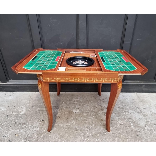 1038 - An Italian marquetry games table, incorporating a roulette wheel, backgammon and chequerboard, 74cm ... 