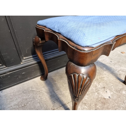 1040 - A 1930s walnut stool, in the 18th century style, 60cm wide.