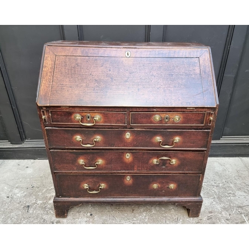 1041 - An 18th century oak bureau, 92cm wide.