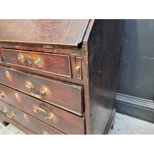 1041 - An 18th century oak bureau, 92cm wide.