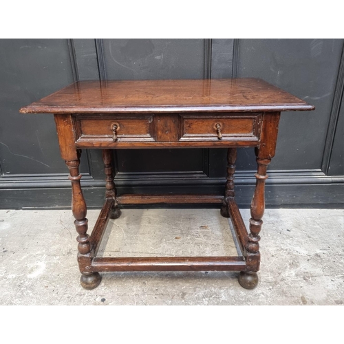 1044 - An early 18th century oak single drawer side table, 81cm wide, (feet replaced).