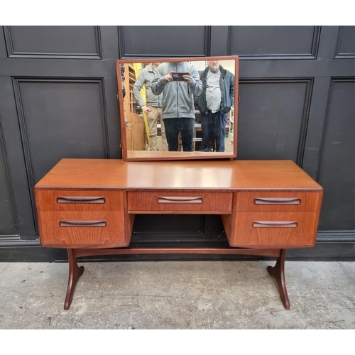 1048 - A mid-century G-Plan mirror back dressing table, 137cm wide, (damage to mirror support); together wi... 