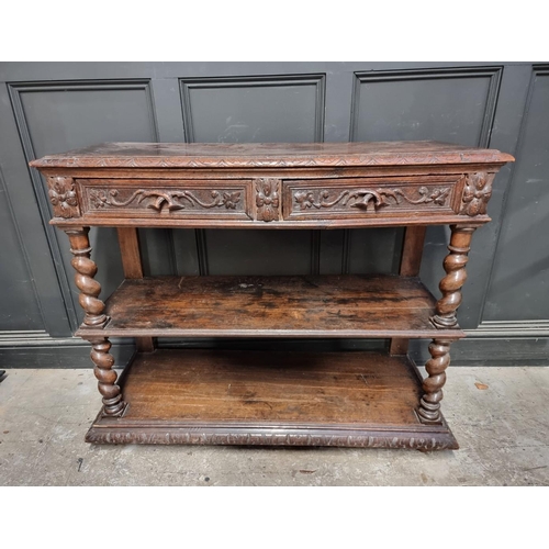 1050 - A late Victorian carved oak three tier buffet, 120cm wide.