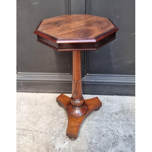 1056 - A mahogany octagonal tripod table, 39cm wide.