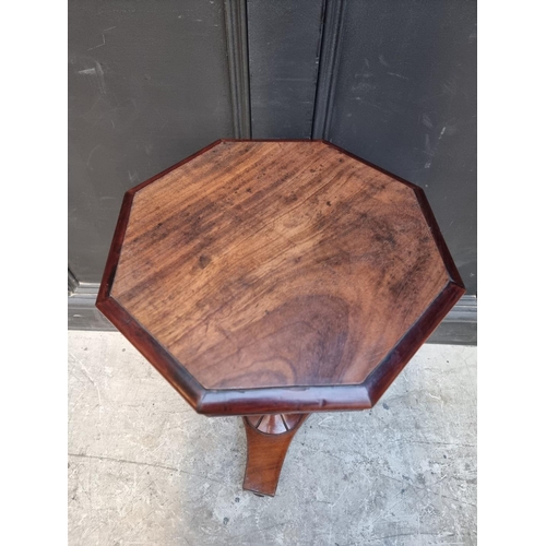 1056 - A mahogany octagonal tripod table, 39cm wide.