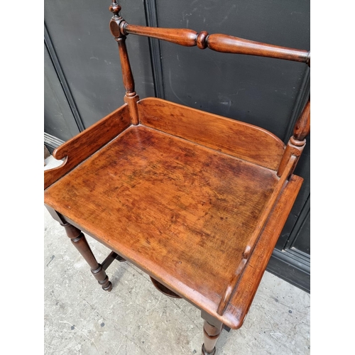 1062 - An unusual mahogany washstand, 63.5cm wide.