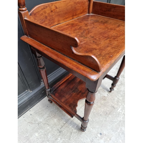 1062 - An unusual mahogany washstand, 63.5cm wide.