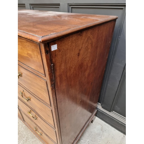 1064 - An antique mahogany side cabinet, the pair of cupboard doors simulating drawers, 108.5cm wide.... 